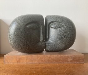 Kiss, polyphant stone on wood base - £5,000